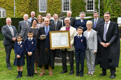 Alan Norton (Front 4th from left) receives the Harper Award from Archbishop Alan Harper with family members, Principal Jonathan Graham, Chairperson of the Board of Management Alison Bothwell and board members, Rev Capt Geoffrey Walmsley and Rev. Joyce Moore. Picture Ken Finegan/Newspics
