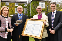 Alan Norton (2nd from left) receives the Harper Award from Archbishop Alan Harper watched by Principal Jonathan Graham and Chairperson of the Board of Management Alison Bothwell. Picture Ken Finegan/Newspics